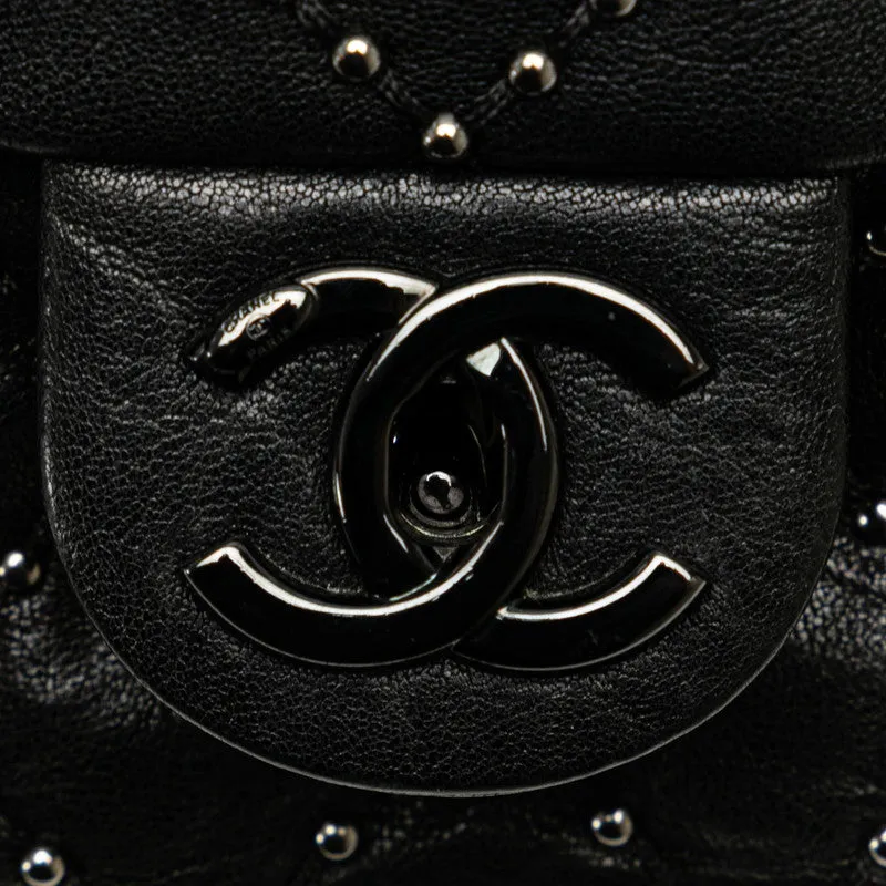 Chanel Medium Quilted Leather Studded Flap Bag Leather Shoulder Bag in Good condition